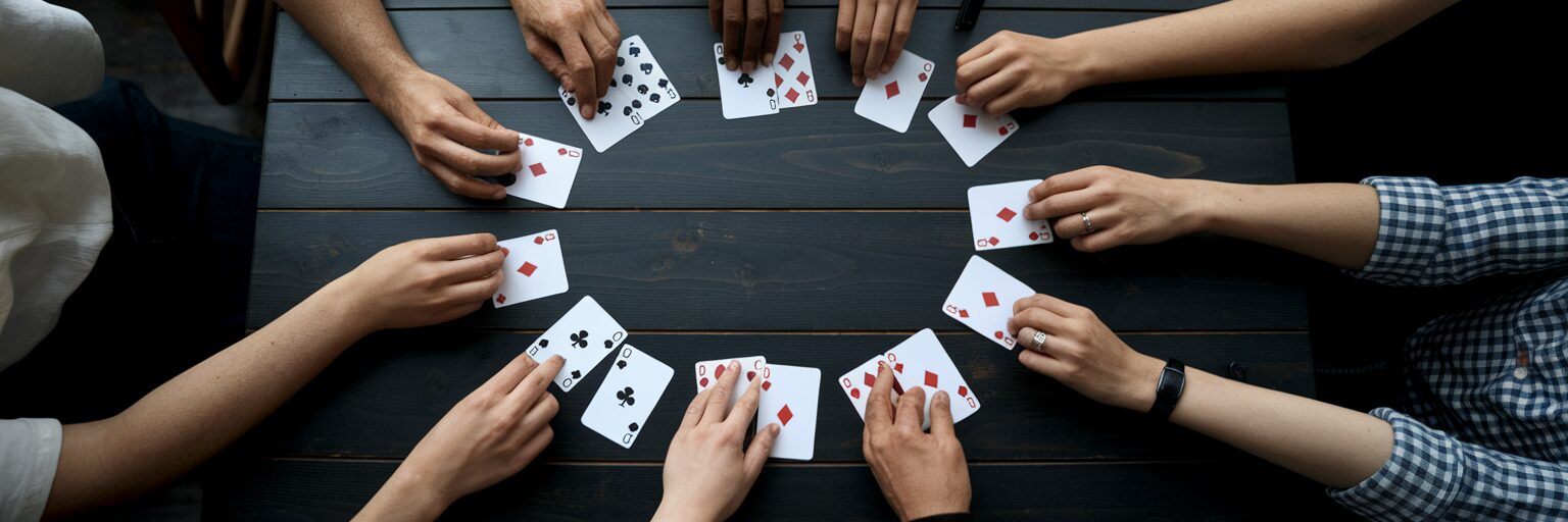 Diverse hands playing card game